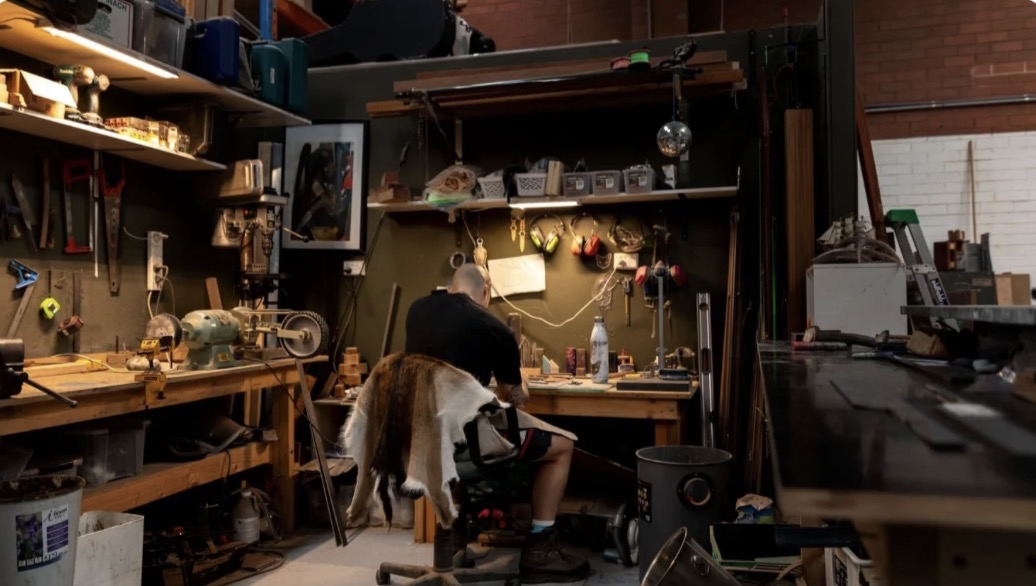 Brenton working in his workshop